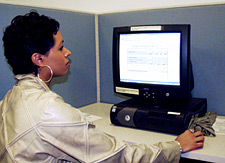 Image of Vanessa, using a computer at work