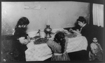[Mrs. Annie De Martius, 46 Laight St., N.Y.C., nursing a dirty baby while she picks nuts with three other children - Rosie, Genevieve, and Tessie.]