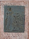 Bronze plaque with woman and tablet