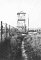 View of watchtower and fence at the Majdanek camp, ...