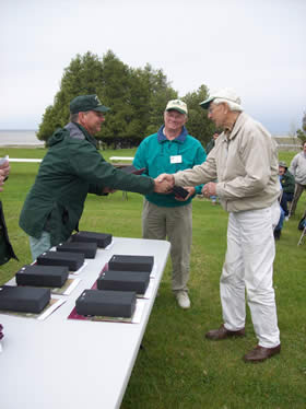 Robert Schmeling accepts the WATA award from District Ranger Dave Silvieus.