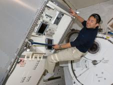 Japanese astronaut Aki Hoshide works in the Kibo module