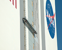 Workers on the Vehicle Assembly Building