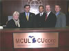 USAID E&E Bureau Chief of Staff Brock D. Bierman, second from left, joins President's Volunteer Service Award recipients, from left, Carolyn Miller, Kevin O'Connor, Hank Hubbard and Drew Egan of the Michigan Credit Union League