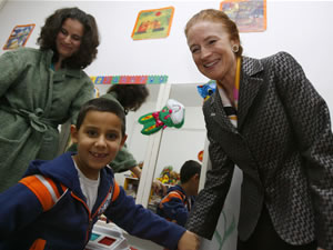 Thanks to USAID, a former state-run, Romanian orphanage has been transformed into a modern child welfare center. Six-year-old Adi* (pictured with Assistant Administrator Fore) attends an on-site day care program which delivers a comprehensive complement of rehabilitative treatments, *Not his real name