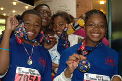 Youths marathon program participants with medals