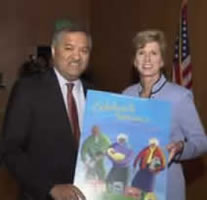 Administrator Whitman receives 2003 Older Americans Month poster from Anthony R. Sarmiento,  Executive Director, Senior Service America at May
7 Baltimore public listening session.