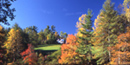 beautiful color photo of Carl Sandburg's home as seen from the Front Lake as one enters the park