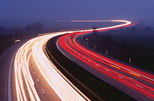 Fig. 7. Highway at night. Vehicle lights are seen as streaks of red and white light.