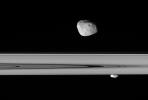 Saturn's moons Janus and Prometheus look close enough to touch in this 
stunningly detailed view