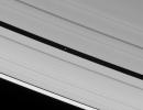 The Cassini spacecraft spies Pan speeding through the Encke Gap, its own private path around Saturn