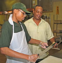 Photo: Broderick Gibbs learns about the food service industry at Bateman Senior Meals.