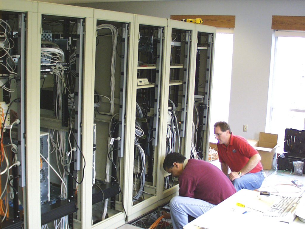 A picture of workers installing our mainframe AWIPS computer.