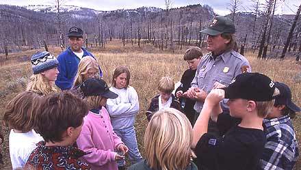 A ranger gathers his students together in an Expedition: Yellowstone class.