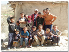 Tajik children in one of the villages whose surrounding fields are impacted by explosive remnants of war.  [Photo courtesy of Tajikistan Mine Action Center.]