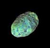 This extreme false-color view of Hyperion shows color variation across the impact-blasted surface of the tumbling moon