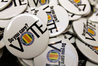 Buttons urging veterans to vote are displayed at the Vietnam Veterans of America leadership conference in Nashville, Tennessee.