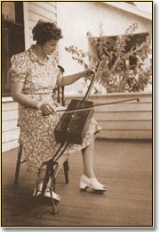 Musician playing a handmade instrument