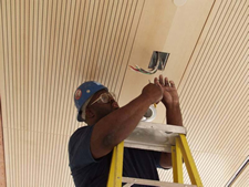 Image of a man doing electrical work