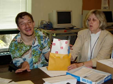 Image of a man and a woman working at a table