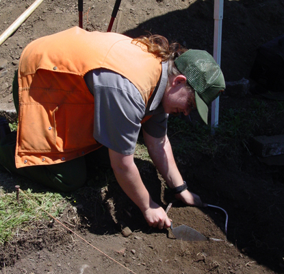 A staff member hard at work on an dig in the park