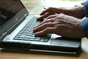 Hands typing on a laptop. If you need further assistance, call 800-853-1351 or email answers@bts.gov.