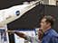 Rep. Ken Calvert, R-Calif., chairman of the House Subcommittee on Space and Aeronautics, was briefed by X-43A engineer Laurie Grindle during a tour of NASA's Dryden Flight Research Center June 2.