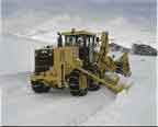 John Deere Grader plowing snow
