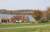 Recreational picture with people biking along lake/resevoir