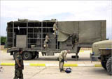 U.S soldiers examine a suspected mobile biological weapons facility in Iraq. 