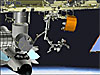 The station robotic arm removing the Canadian Special Purpose Dexterous Manipulator