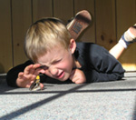 A child discovers a butterfly in the Visitor Center.