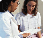 Photo of a female doctor explaining test results to a female patient