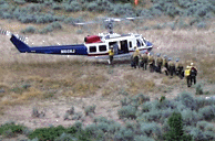 Fire crew loading up in helicopter