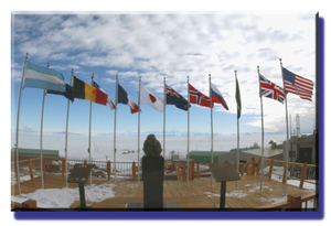 Adm. Byrd statute with Antarctic Treaty nation flags, overlooking McMurdo Sound