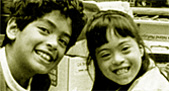 photo of young boy and girl, smiling
