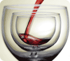 Photo of red wine being poured into a wine glass