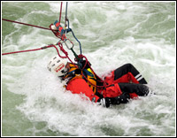 Swiftwater Rescue Teams with the Los Angeles County Fire Department's Urban Search and Rescue Team practice rescue techniques during a recent training drill. Photo by: Jason Pack/FEMA News Photo 