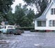 A house and truck on a flooded street