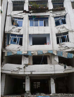 Adjacent bldgs may have averted collapse of 5-story masonry bldg in Dujiangyan [photo: Build Change]