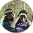 Two birdwatchers look through binoculars.