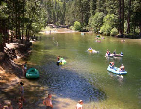 Merced River and visitors in rafts.