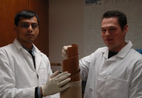 researchers hold the polymer for their filtration system