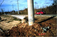 Base of newly replaced concrete power pole
