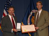 NASA Administrator Michael Griffin, left, presents Jeffrey Jackson with an Exceptional Achievement Award.