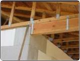 Hurricane straps connect roof trusses to walls