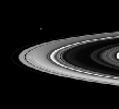 This movie begins with a view of the sunlit side of the rings. As the spacecraft speeds from south to north, the rings appear to tilt downward and collapse to a thin plane