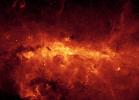 Our Milky Way is a dusty place. So dusty, in fact, that we cannot see the 
center of the galaxy in visible light. Thanks to Spitzer's excellent resolution, the dusty features within the 
galactic center are seen in unprecedented detail