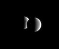 Dione steps in front of Tethys for a few minutes in an occultation, or 
mutual event. These events occur frequently for the Cassini spacecraft 
when it is orbiting close to the ringplane