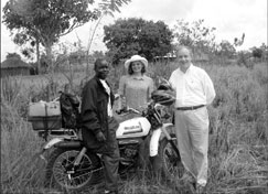 Amb. Tobias and Dr. Julie L. Gerberding, CDC Director, with community health worker delivering antiretroviral medications by motorcycle [Photo by Jimmy Kolker]